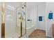 Well-lit bathroom featuring glass-door shower and separate soaking tub at 5115 Morning Splash Ave, Las Vegas, NV 89131