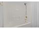 A full bathtub and shower combination with white tiling at 5115 Morning Splash Ave, Las Vegas, NV 89131