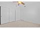 Neutral bedroom with carpet, closet with sliding doors, and ceiling fan at 5115 Morning Splash Ave, Las Vegas, NV 89131