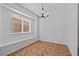 Dining room with modern lighting and large window at 5115 Morning Splash Ave, Las Vegas, NV 89131