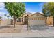 Charming single-story home with a two-car garage, well-manicured front yard, and desert landscaping at 5115 Morning Splash Ave, Las Vegas, NV 89131