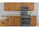 Close up of kitchen with stainless appliances and wood cabinetry at 5115 Morning Splash Ave, Las Vegas, NV 89131