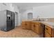 Kitchen featuring stainless appliances, breakfast bar and wood cabinetry at 5115 Morning Splash Ave, Las Vegas, NV 89131