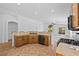 Bright kitchen with tile flooring and breakfast bar that connects to the living area with lots of light at 5115 Morning Splash Ave, Las Vegas, NV 89131