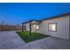 Backyard featuring a gravel area, turf, and covered patio perfect for entertaining at 5200 Blanton Dr, Las Vegas, NV 89122