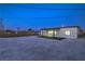 Backyard featuring a gravel area, turf, and covered patio perfect for entertaining at 5200 Blanton Dr, Las Vegas, NV 89122