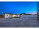 Backyard featuring a gravel area, turf, and covered patio perfect for entertaining at 5200 Blanton Dr, Las Vegas, NV 89122