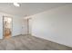 A clean carpeted bedroom with white walls and view of the bathroom at 5200 Blanton Dr, Las Vegas, NV 89122