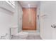 Updated bathroom featuring a glass-enclosed shower with stylish tiling, modern fixtures, and ample natural light at 5811 Pack Trl, Las Vegas, NV 89118