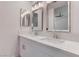 Bright bathroom featuring a double sink vanity with quartz countertop and modern lighting at 5811 Pack Trl, Las Vegas, NV 89118
