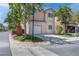Delightful home boasts a well-kept lawn, lovely trees, and attached garage at 5811 Pack Trl, Las Vegas, NV 89118