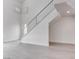 Inviting foyer showcasing a modern staircase, sleek flooring, and an abundance of natural light, enhancing the entry at 5811 Pack Trl, Las Vegas, NV 89118