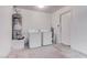 Laundry room featuring a washer, a dryer, and a hot water heater at 5811 Pack Trl, Las Vegas, NV 89118