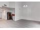 Spacious living area with sleek gray flooring, bright white walls, and an open layout perfect for entertaining at 5811 Pack Trl, Las Vegas, NV 89118
