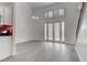 Open living space boasts soaring ceilings, abundant natural light, sleek flooring, and access to outdoor living at 5811 Pack Trl, Las Vegas, NV 89118