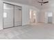 Spacious main bedroom features plush carpet and ensuite bathroom at 5811 Pack Trl, Las Vegas, NV 89118