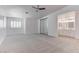 Spacious main bedroom with plush carpet, ceiling fan, and double sink vanity at 5811 Pack Trl, Las Vegas, NV 89118