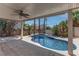 Covered patio with pool and spa, providing a serene outdoor space for relaxation and entertainment at 5811 Pack Trl, Las Vegas, NV 89118