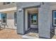 Covered entrance way showing tile landing and exterior finish details at 6197 Hibiscus Garden St # 177, North Las Vegas, NV 89081