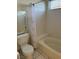 Clean bathroom with tiled tub/shower combo, toilet, and a mirrored vanity at 6208 Mandarin Dr, Las Vegas, NV 89108
