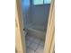 Bathroom featuring a tiled tub, toilet, and tiled floors at 6208 Mandarin Dr, Las Vegas, NV 89108