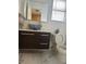 Stylish bathroom featuring a vessel sink, modern vanity, and a contemporary mirror, creating a luxurious and functional space at 6208 Mandarin Dr, Las Vegas, NV 89108