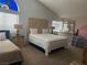 Spacious bedroom with unique heart-shaped headboard and neutral decor, creating a cozy and inviting atmosphere at 6208 Mandarin Dr, Las Vegas, NV 89108