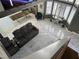 Open-concept living room featuring a comfortable gray sofa and a large wall-mounted TV at 6208 Mandarin Dr, Las Vegas, NV 89108