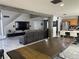 Open-concept floor plan showcasing kitchen, dining area, and living room at 6208 Mandarin Dr, Las Vegas, NV 89108