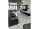 Bright living room with bay window, modern entertainment center, and comfortable seating at 6208 Mandarin Dr, Las Vegas, NV 89108