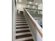 View of the staircase featuring wooden steps and white risers leading to an upper level at 6208 Mandarin Dr, Las Vegas, NV 89108
