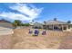 Backyard featuring a patio, a seating area, a yard, and a storage shed at 6920 Singing Dunes Ln, Las Vegas, NV 89145