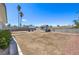 Large backyard with a shed, patio area, and mature trees, offering privacy at 6920 Singing Dunes Ln, Las Vegas, NV 89145