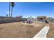 Spacious backyard with cinder block perimeter wall, small shed, and room for patio furniture at 6920 Singing Dunes Ln, Las Vegas, NV 89145