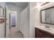 Bathroom featuring a shower with curtain and a sink with a decorative mirror at 6920 Singing Dunes Ln, Las Vegas, NV 89145