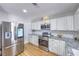 Spacious kitchen featuring stainless steel appliances, granite countertops and plenty of cabinet space at 6920 Singing Dunes Ln, Las Vegas, NV 89145