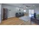 Cozy living room featuring a comfortable sofa, ceiling fan, and sliding glass doors for natural light at 6920 Singing Dunes Ln, Las Vegas, NV 89145