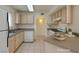 Well-lit kitchen featuring updated appliances, neutral countertops, and a functional layout at 698 S Racetrack Rd # 711, Henderson, NV 89015