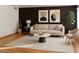 Stylishly decorated living room with modern furnishings, neutral tones and hardwood floors at 698 S Racetrack Rd # 711, Henderson, NV 89015