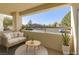 Relaxing patio with comfortable seating and views of the parking area and nearby buildings at 698 S Racetrack Rd # 711, Henderson, NV 89015