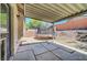 Back patio featuring a covered seating area and trampoline at 715 Heritage Point Dr, Henderson, NV 89002