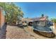 A spacious backyard offering a covered patio, storage shed, and a trampoline for outdoor enjoyment at 715 Heritage Point Dr, Henderson, NV 89002