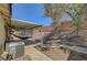 Backyard featuring a covered patio with hammock and an easy-care gravel area at 715 Heritage Point Dr, Henderson, NV 89002
