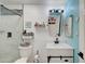 Bright bathroom with modern fixtures, a shower, and a stylish vanity with coastal-themed decor at 715 Heritage Point Dr, Henderson, NV 89002