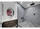 Bathroom features a modern vanity and updated walk-in shower with dark gray tile at 715 Heritage Point Dr, Henderson, NV 89002