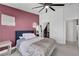 Bedroom with a large bed, gray curtains, closet, and a full length mirror reflecting the space at 715 Heritage Point Dr, Henderson, NV 89002