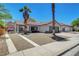 A well-kept single-story home showing a tile roof and desert landscaping with an extended driveway at 715 Heritage Point Dr, Henderson, NV 89002