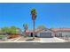 Charming single-story home featuring a 2-car garage, tile roof, desert landscaping, and mature palm trees at 715 Heritage Point Dr, Henderson, NV 89002