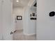 Hallway with tile flooring, leading to a modern bathroom and a stylishly appointed room at 715 Heritage Point Dr, Henderson, NV 89002