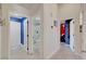 Hallway with tile flooring leading to a modern bathroom and colorfully painted room at 715 Heritage Point Dr, Henderson, NV 89002